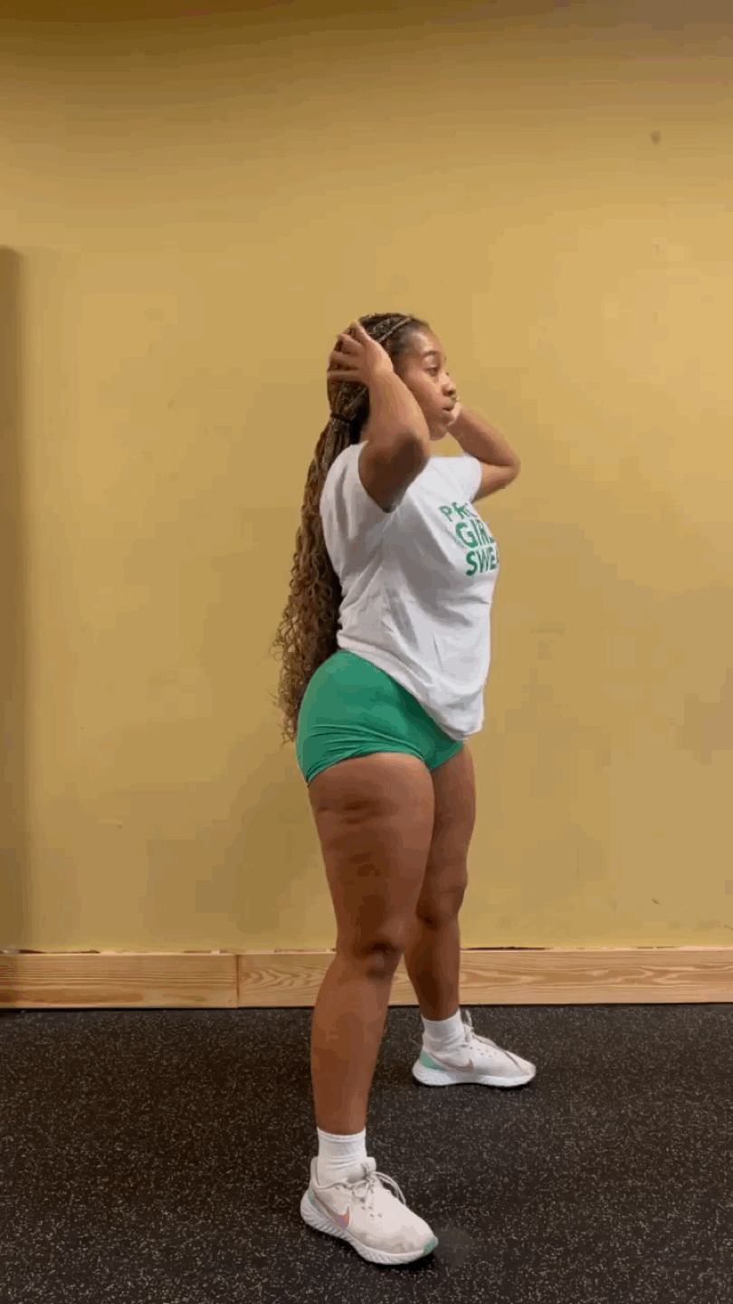 Demonstration of sumo squat exercise